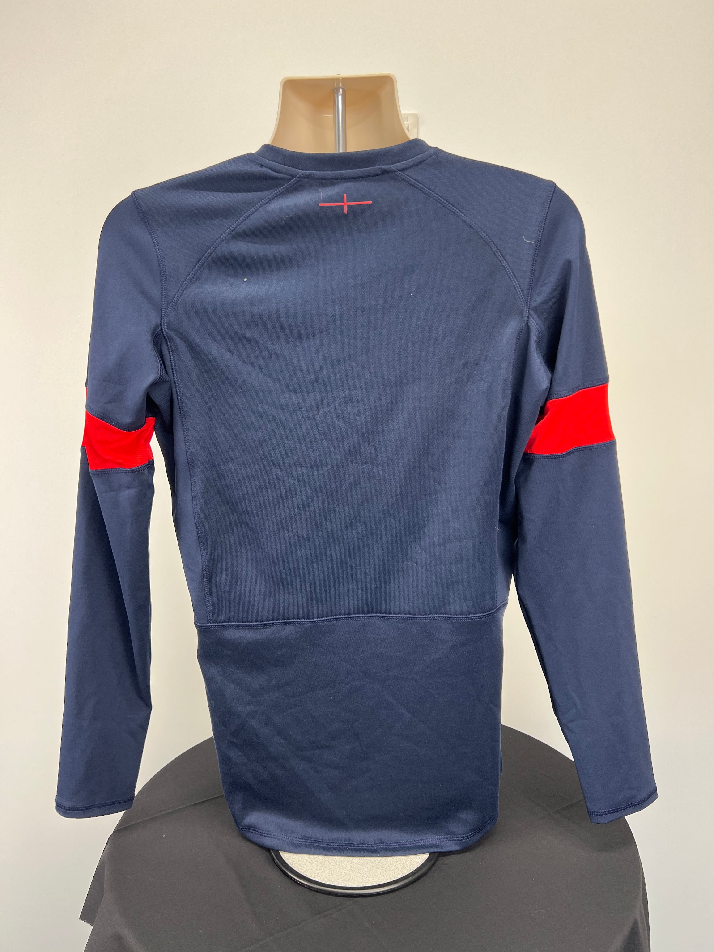 Back view of navy and red Umbro England rugby training long sleeve top showing plain design with raglan sleeves