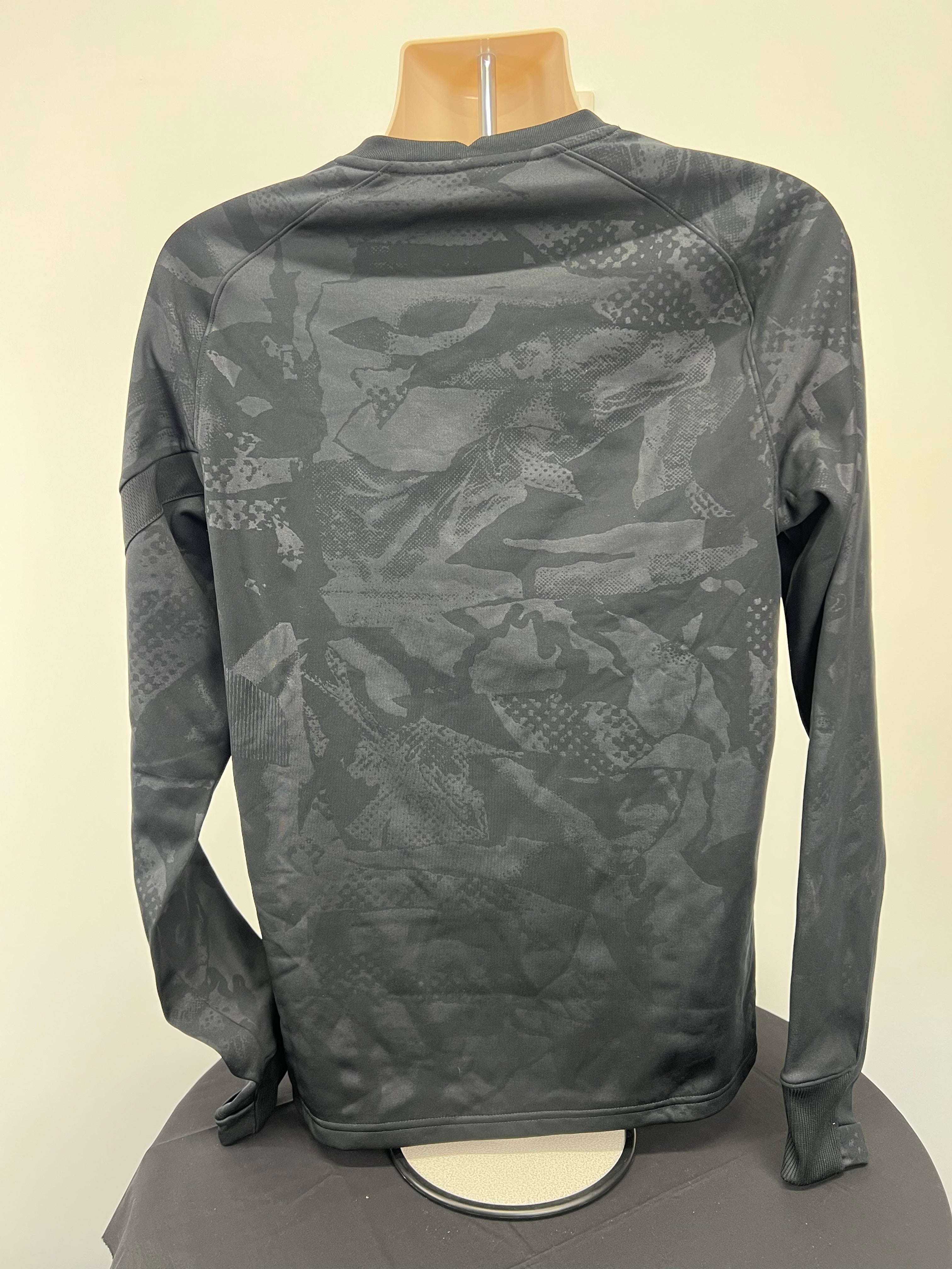 Back view of Nike Liverpool FC training top showing subtle dark patterned fabric
