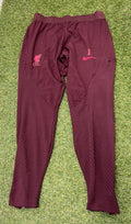 Front view of Liverpool FC Nike Dri-FIT ADV maroon training pants with club crest and Nike swoosh