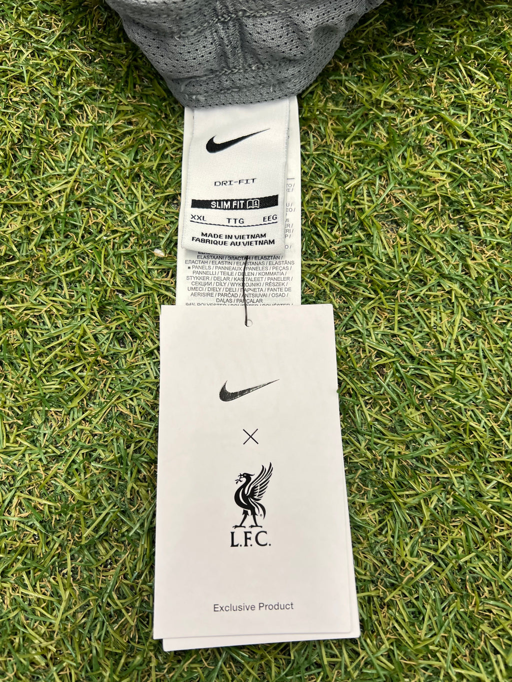 Nike and Liverpool FC co-branded label on inner waist with care tags