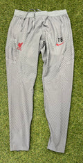 Front view of grey Liverpool FC Nike Dri-FIT ADV training pants with club crest and initials TB