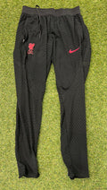 Front view of black Nike Liverpool FC Dri-FIT training bottoms with logos