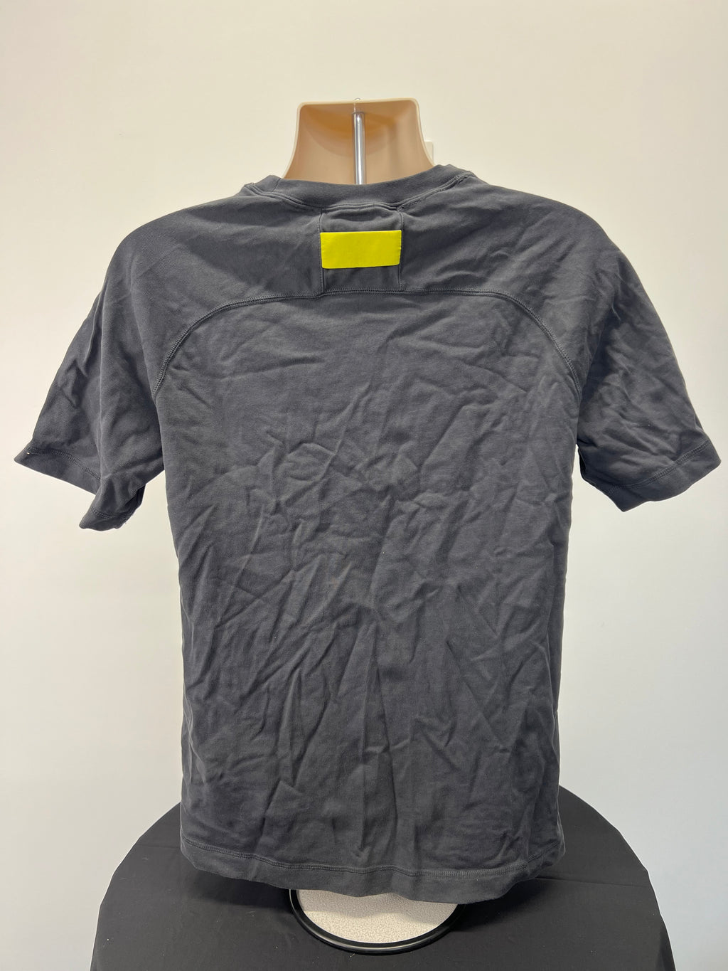 Rear view of Liverpool FC Nike grey t-shirt showing plain design with yellow patch near neckline