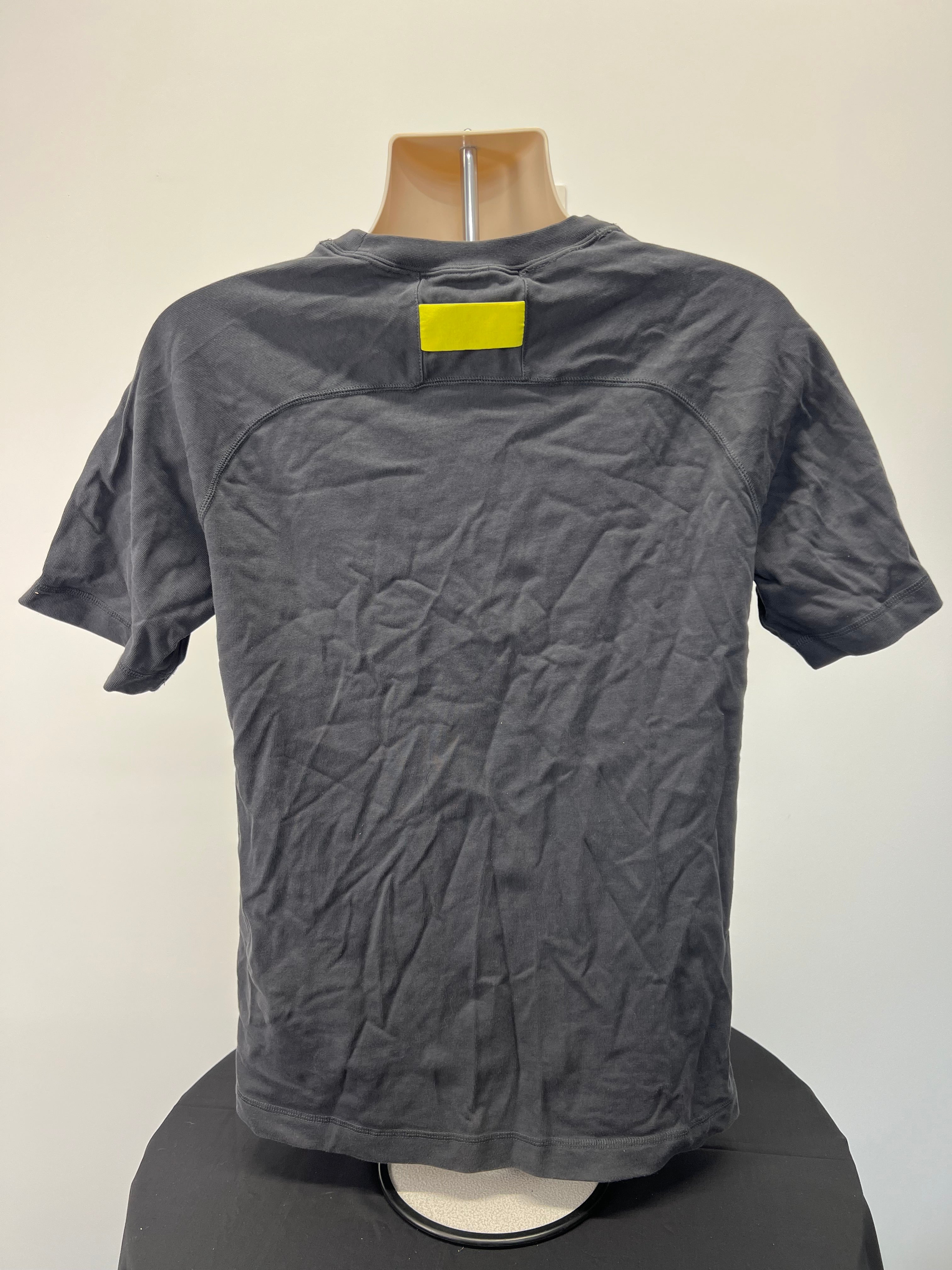 Rear view of Liverpool FC Nike grey t-shirt showing plain design with yellow patch near neckline