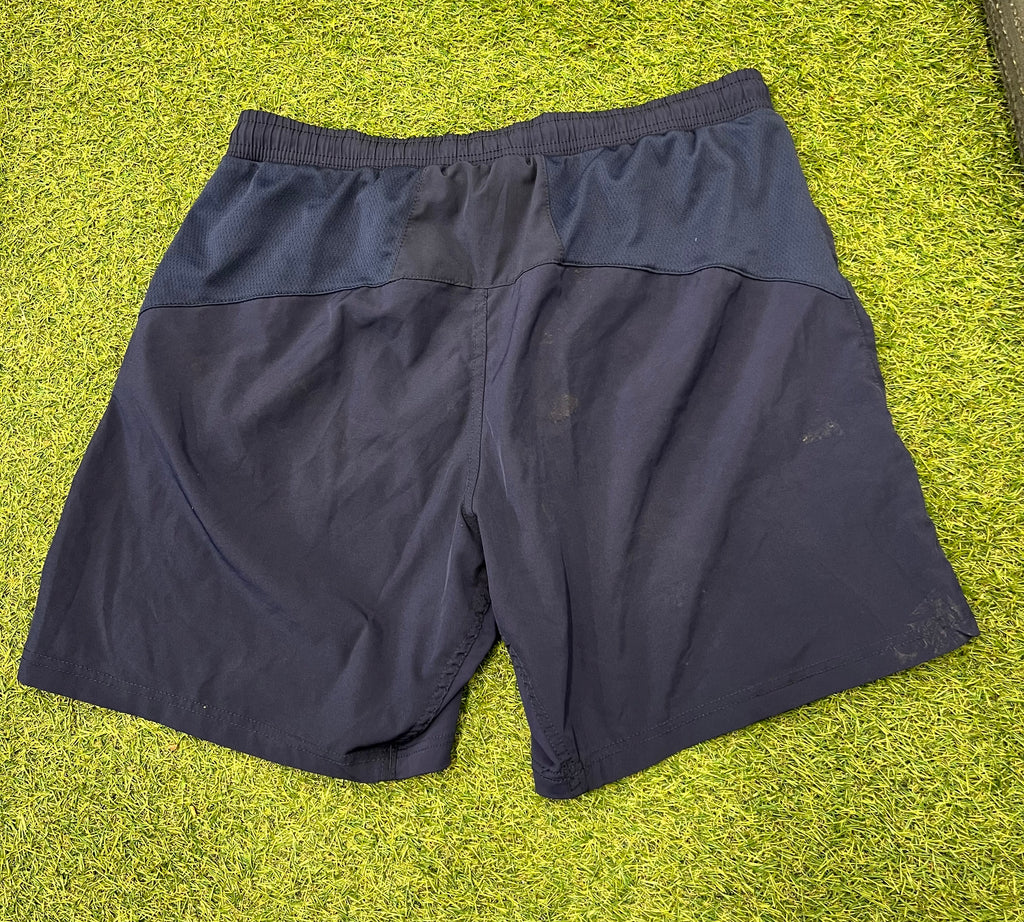 Back view of navy blue London Irish men's training shorts showing mesh panel on waistband
