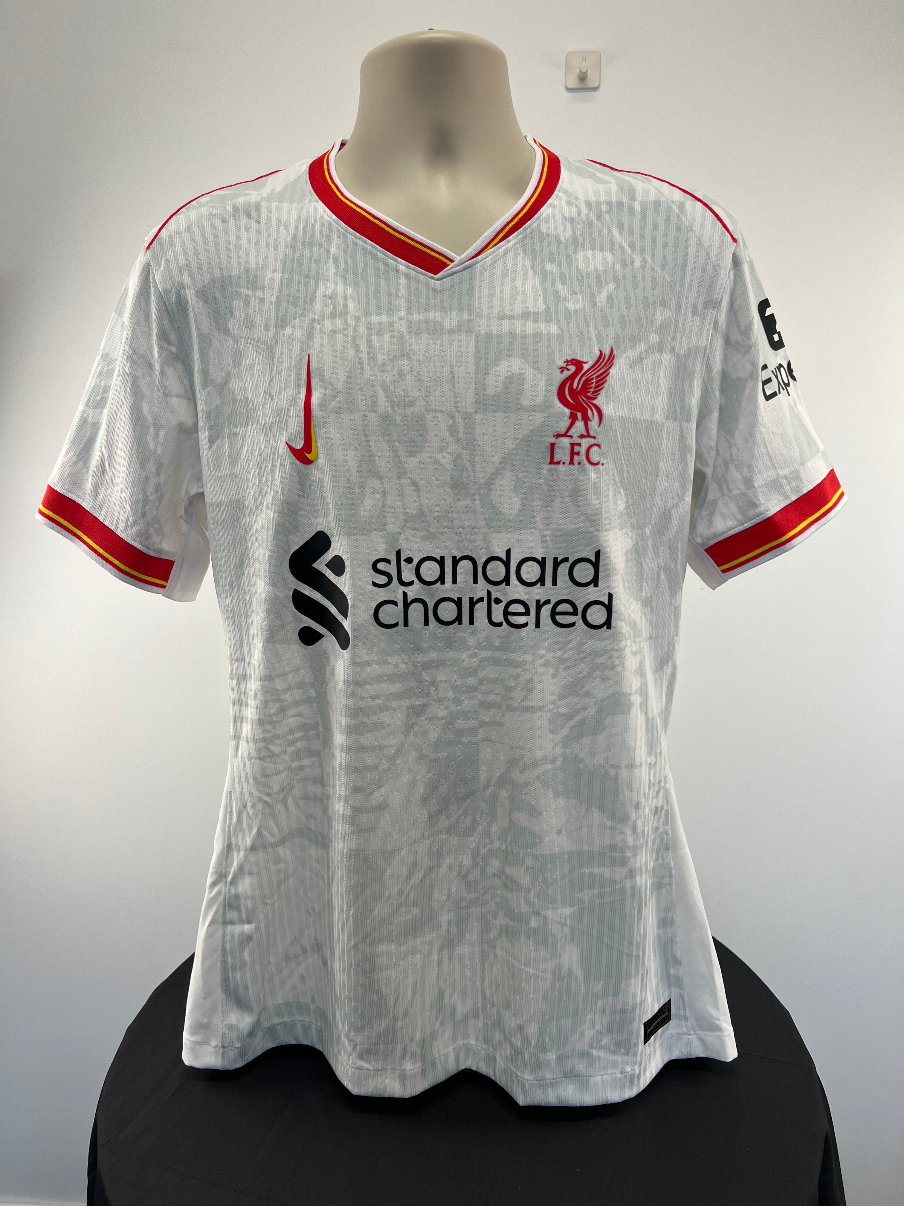 Front view of Liverpool FC 22/23 away football shirt with club crest, Nike logo, and sponsor print