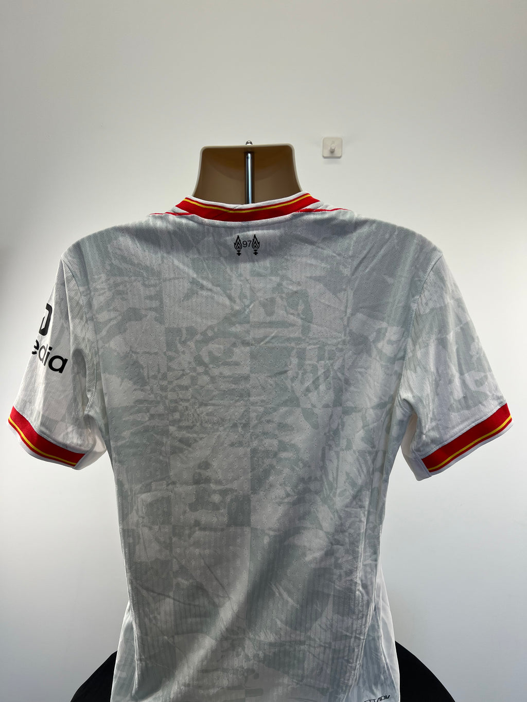 Back view of Liverpool FC 22/23 away football shirt with subtle patterned design and collar detail