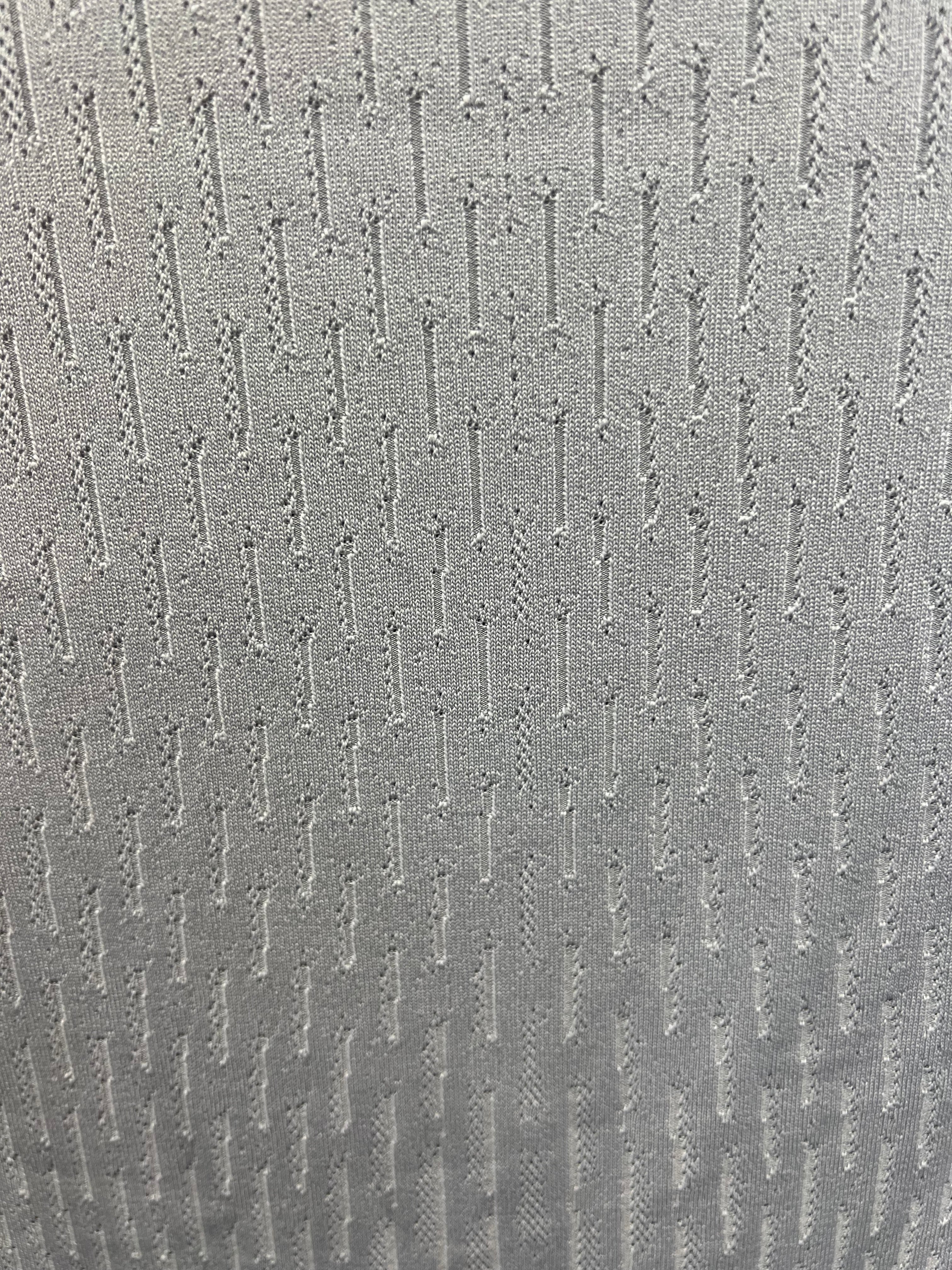 Close-up of fabric texture showing knit pattern on Liverpool FC training top