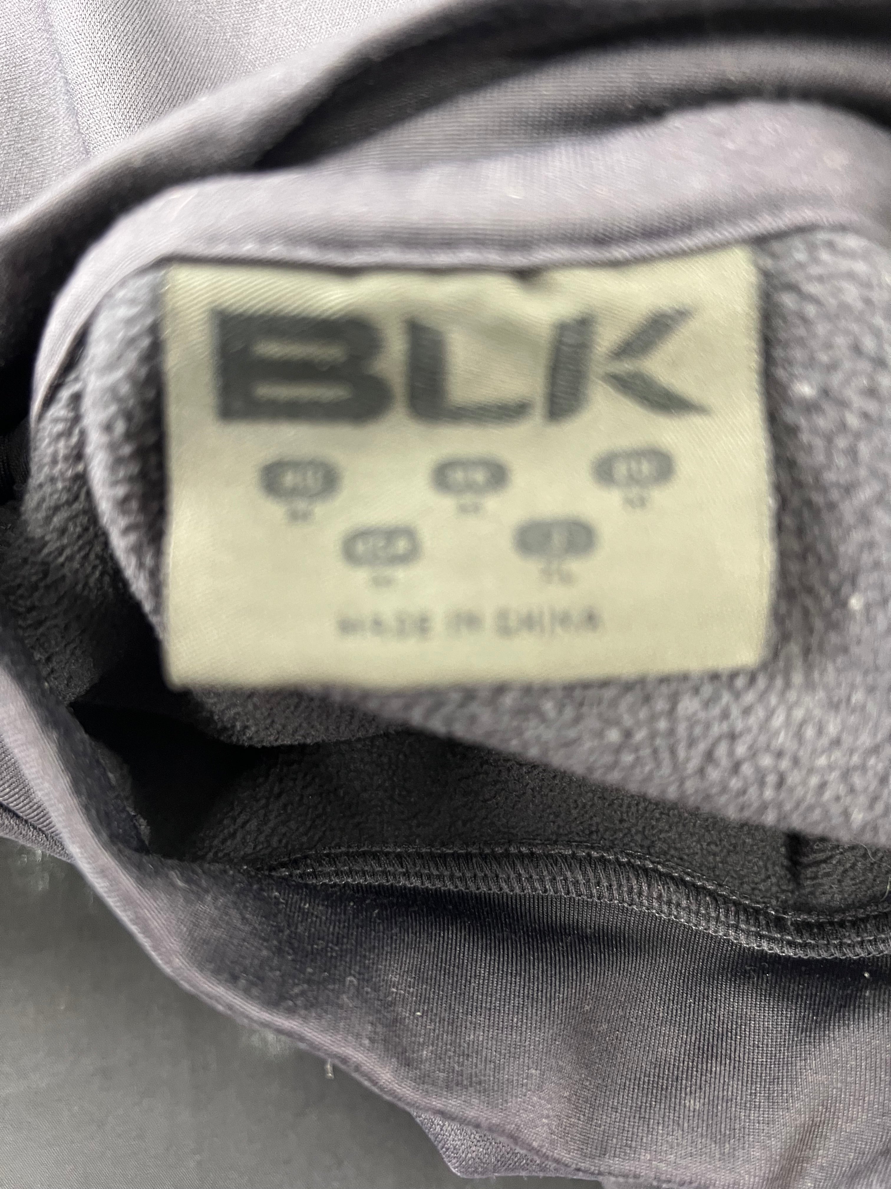 Close-up of BLK label inside London Irish sweatshirt showing product branding
