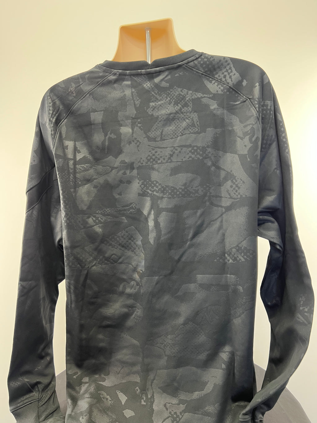 Rear view of black Liverpool FC long sleeve training top showing subtle tonal graphics and raglan sleeves