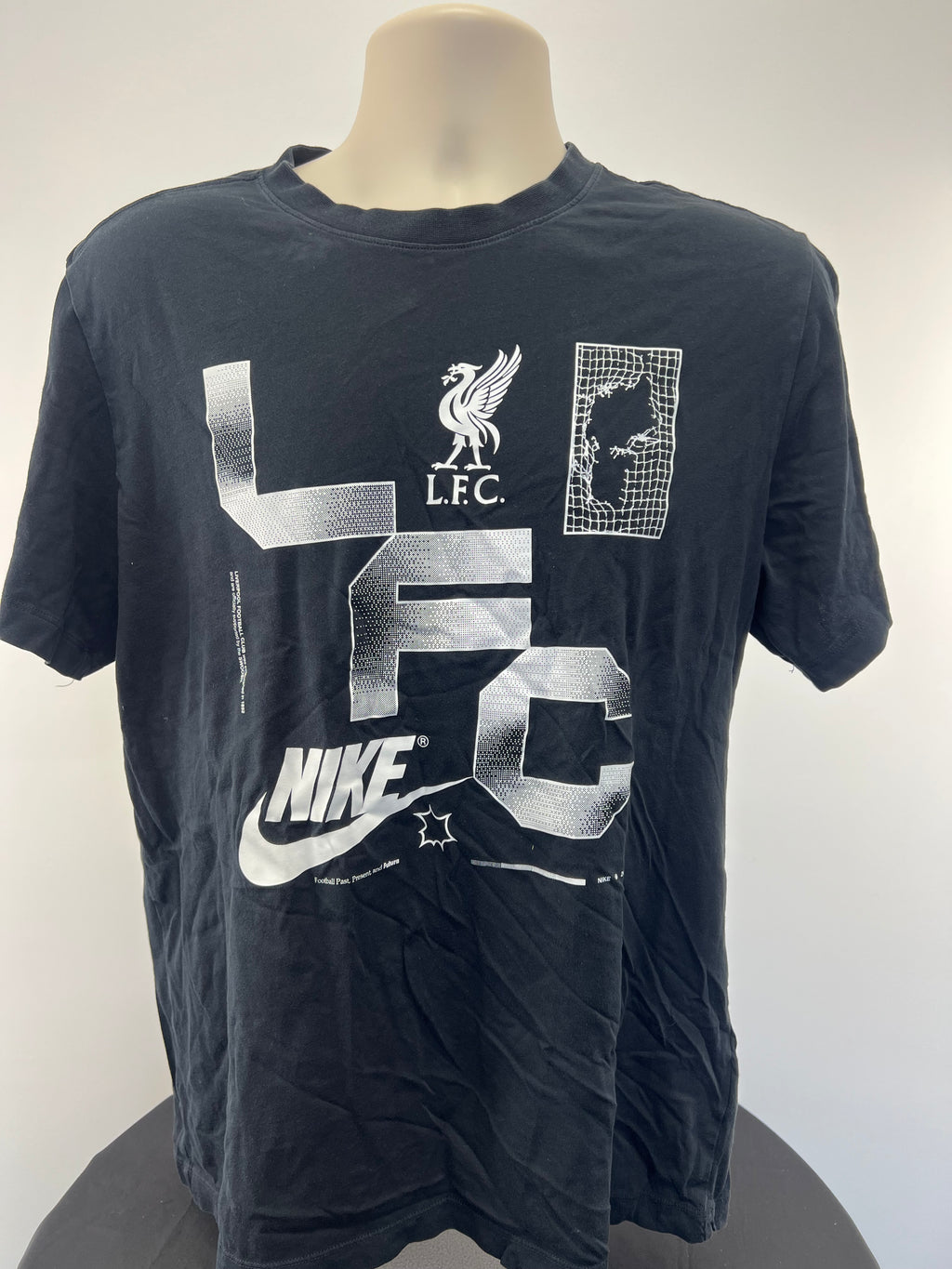 Front view of black Liverpool FC Nike T-shirt with white LFC letters and football graphics