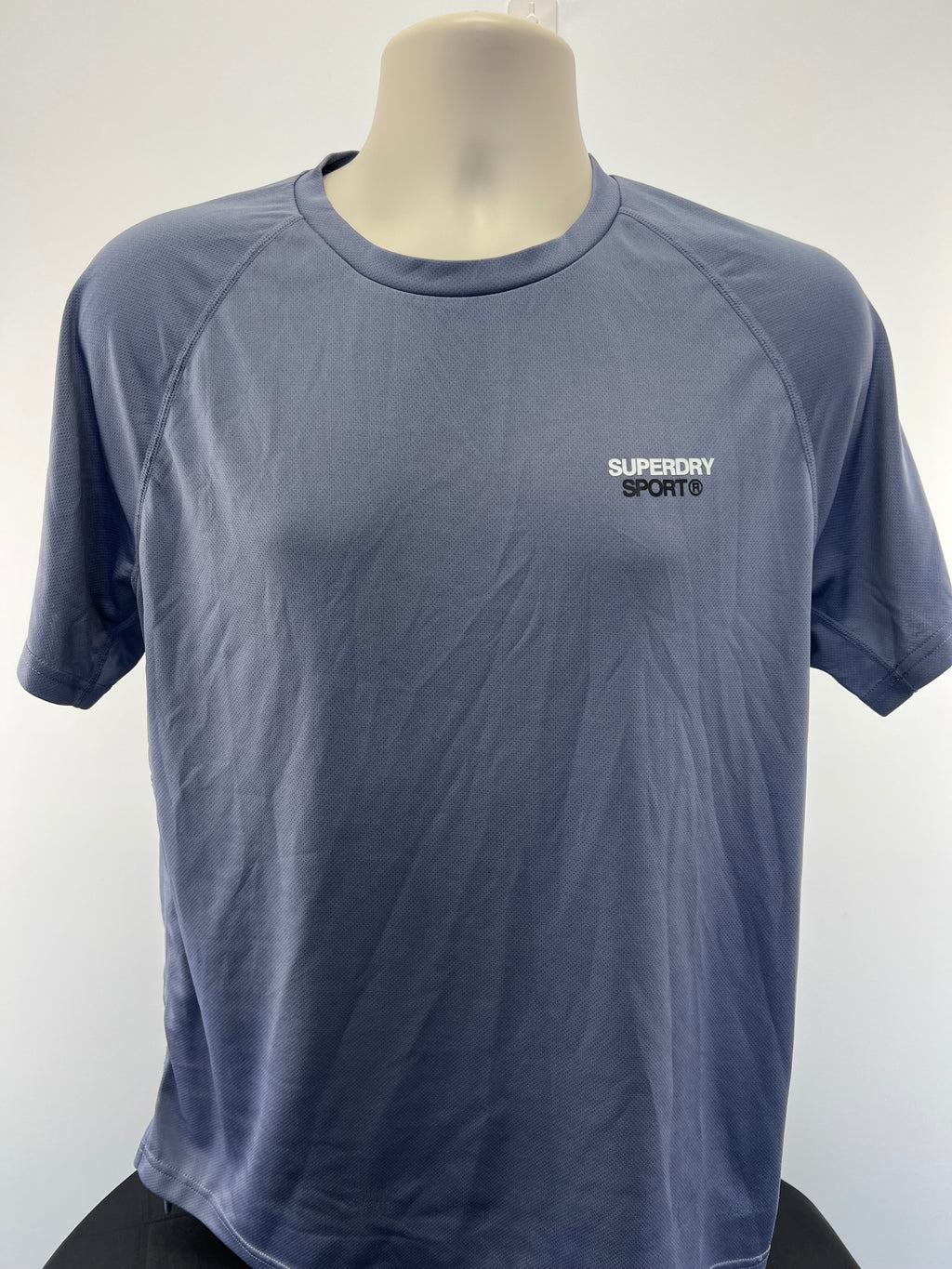 Front view of Superdry men's blue sports t-shirt with small logo on chest