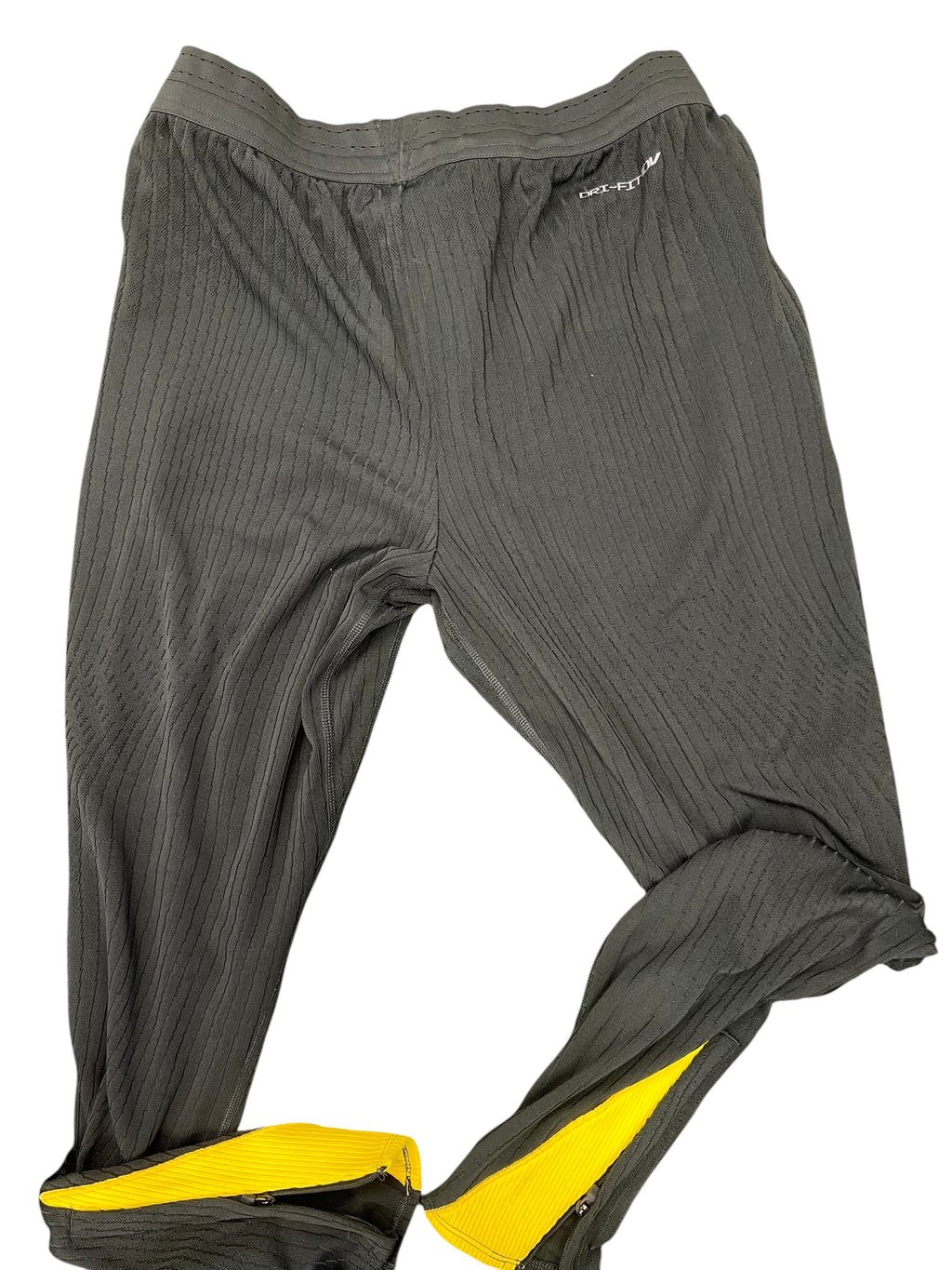 Back view of black Liverpool FC training bottoms showing elastic waistband and ankle zips