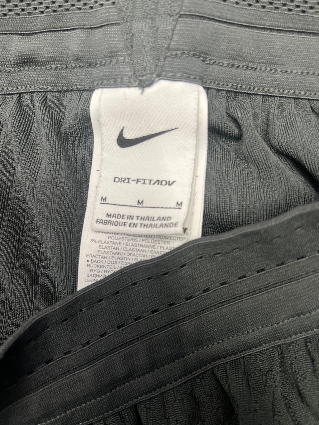 Close-up of Nike Dri-FIT label inside Liverpool FC training bottoms