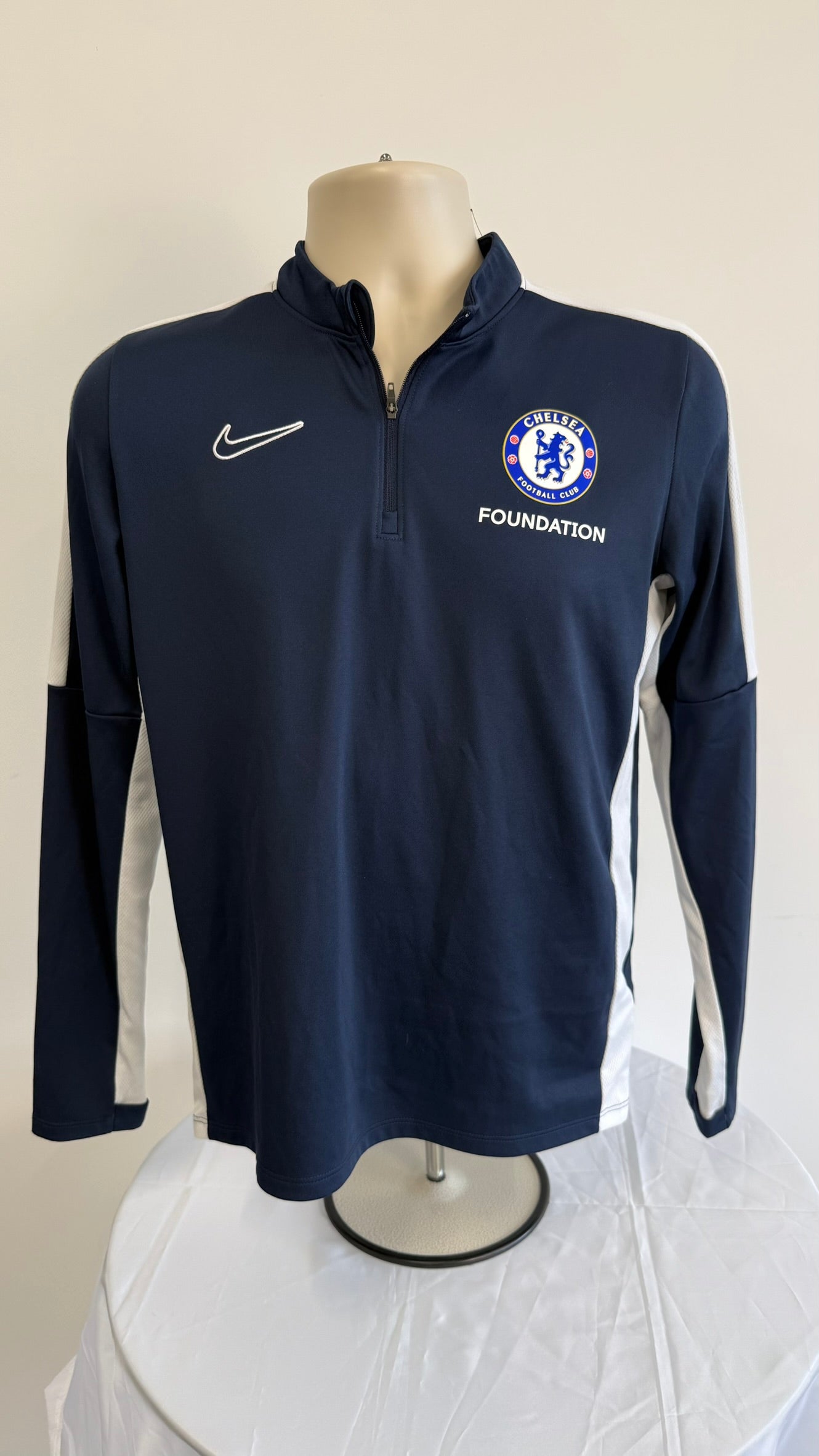 Front view of Nike Chelsea Foundation Dri-FIT long sleeve training top in navy blue with white accents