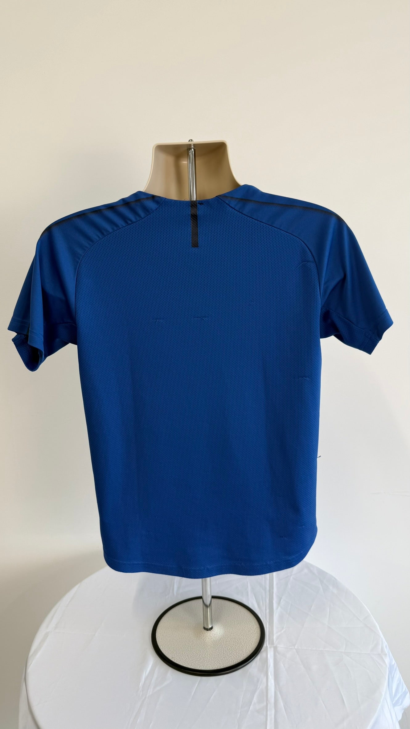 Back view of Puma Italy kids football shirt in blue