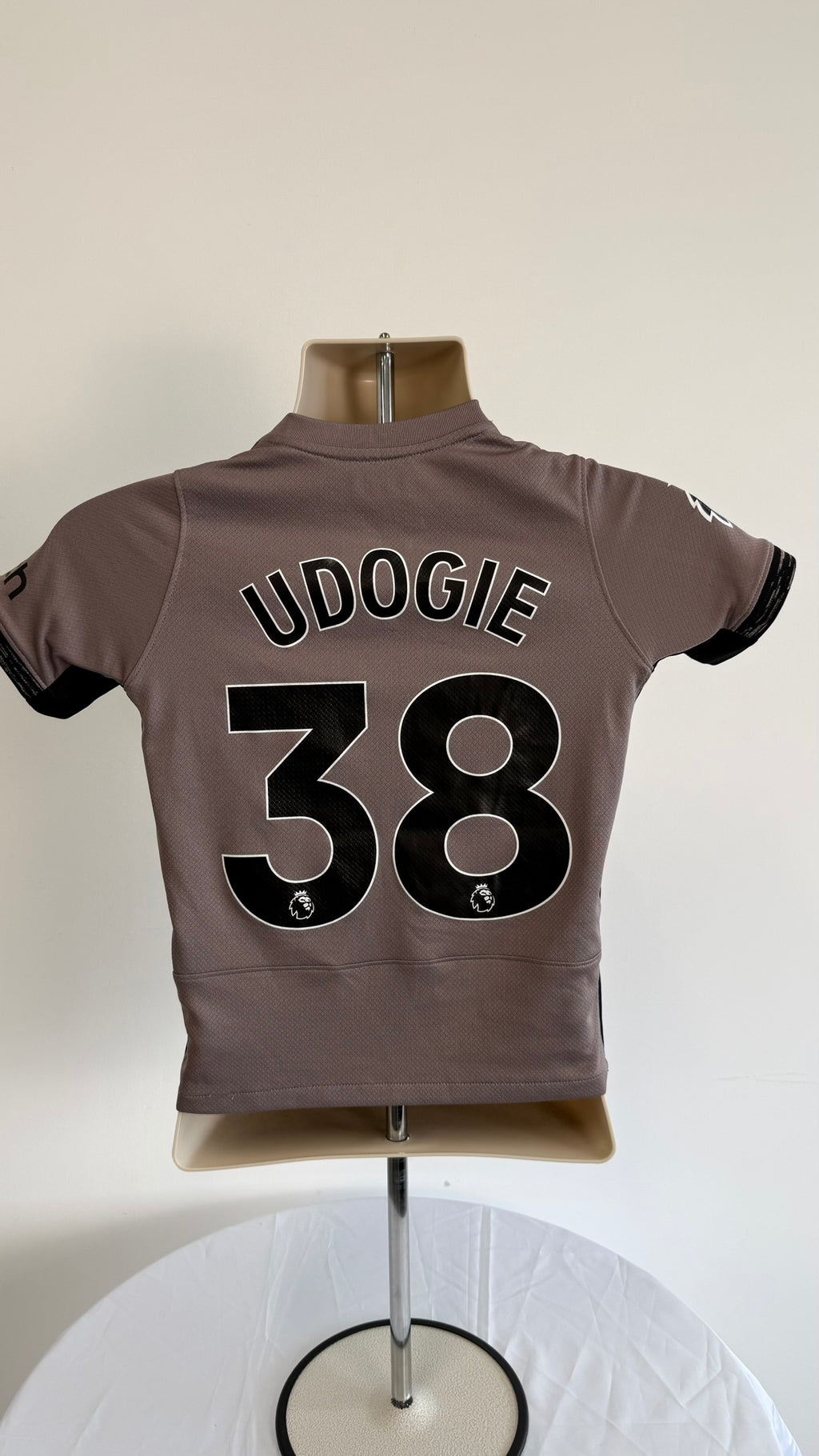 Back view showing Udogie name and number 38 on Tottenham kids shirt