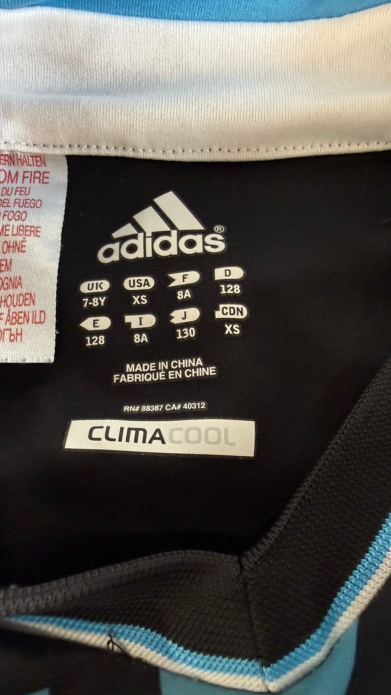 Adidas Chelsea FC kids' shirt size label with ClimaCool branding and size details