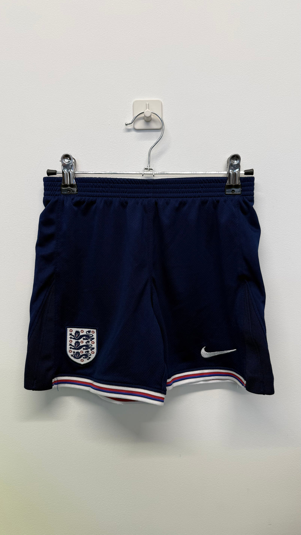 Navy blue kids England Nike football shorts with crest and swoosh logo