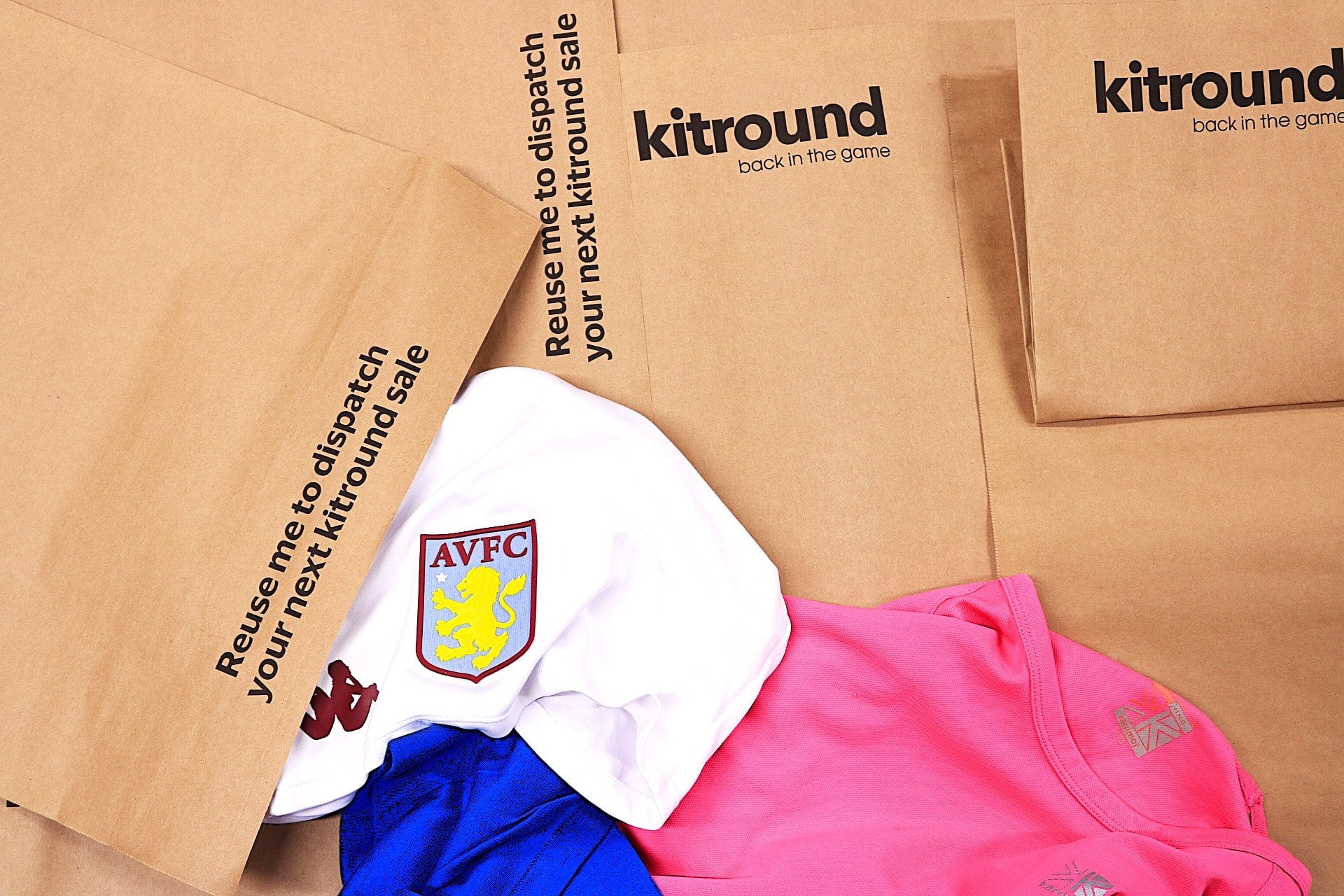 Kitround sports apparel with a shirt and shorts on a cardboard background