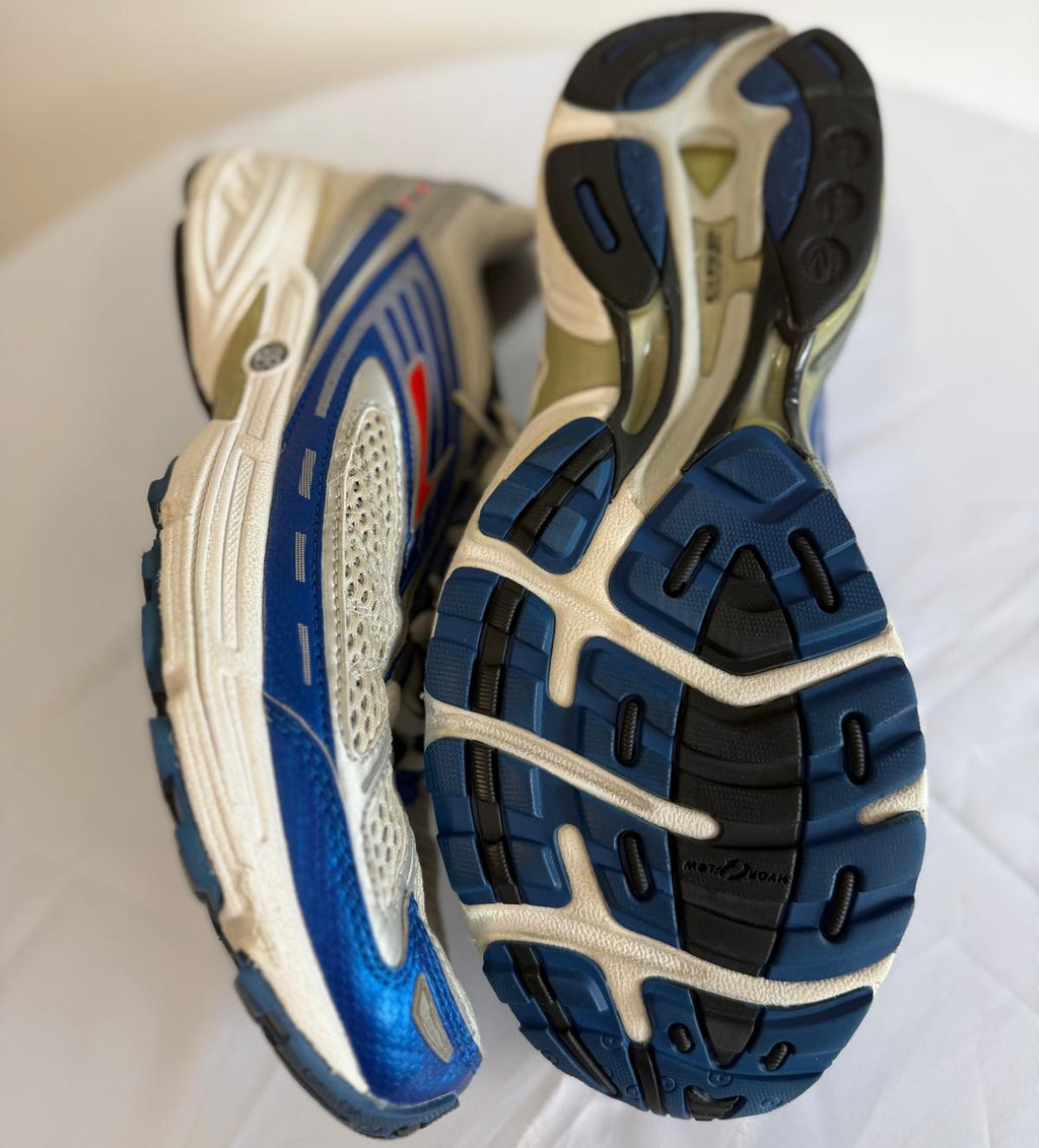 Brooks running trainers showing side design and patterned blue rubber outsoles