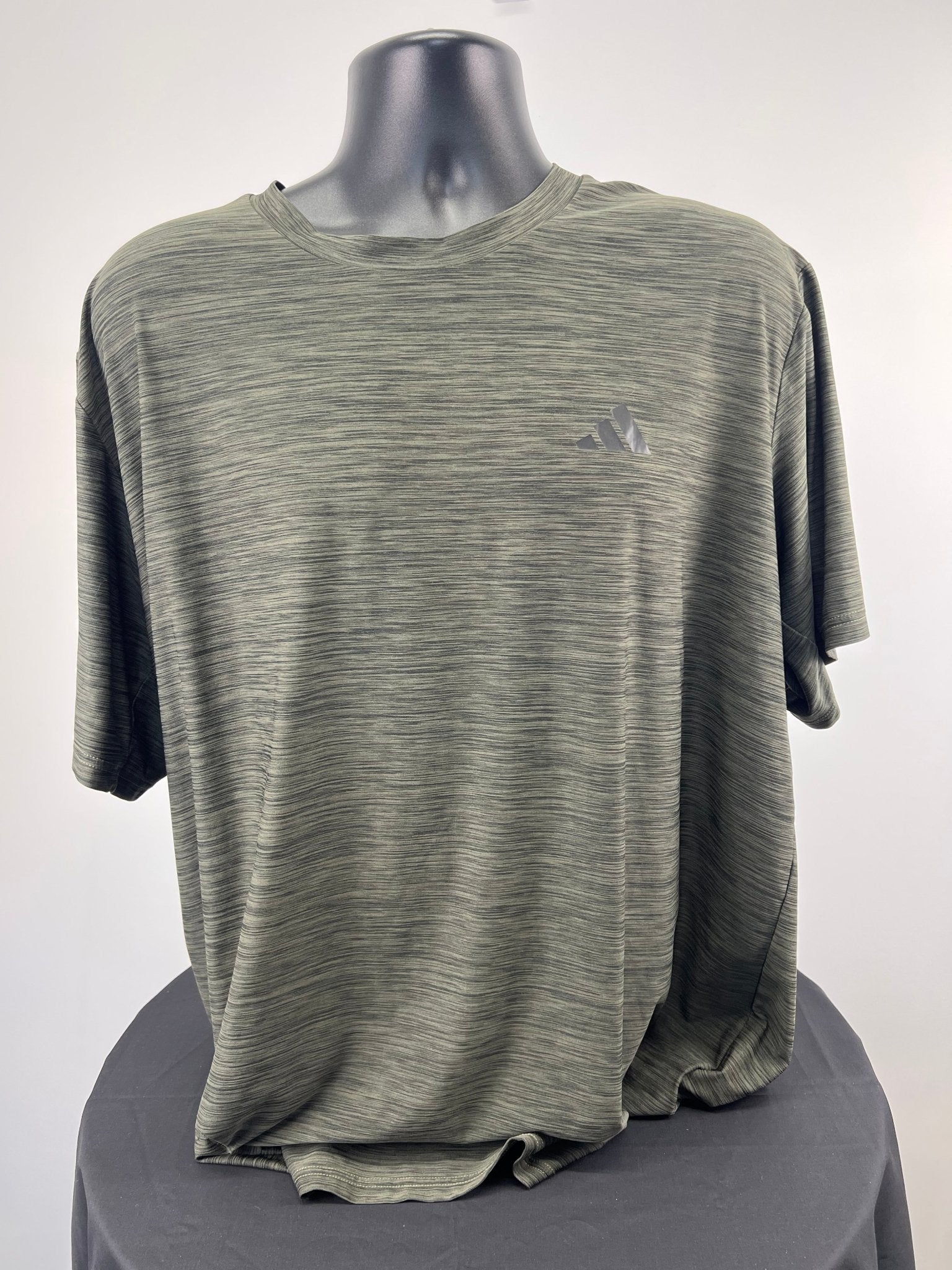 Front view of adidas green marl t-shirt 2XL displayed on a mannequin