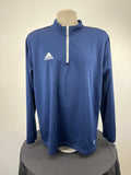 Front view of adidas AEROREADY 1/2 zip long sleeve blue top with white zip and logo