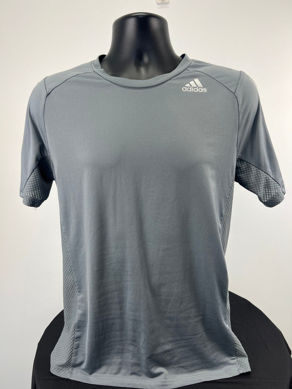 Front view of grey adidas ClimaCool t-shirt on black mannequin