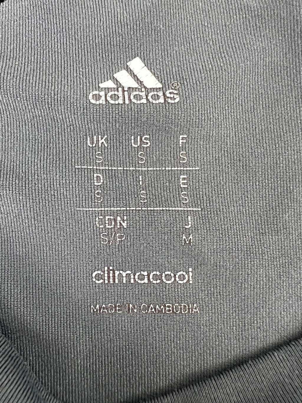 Close-up of adidas ClimaCool t-shirt size label