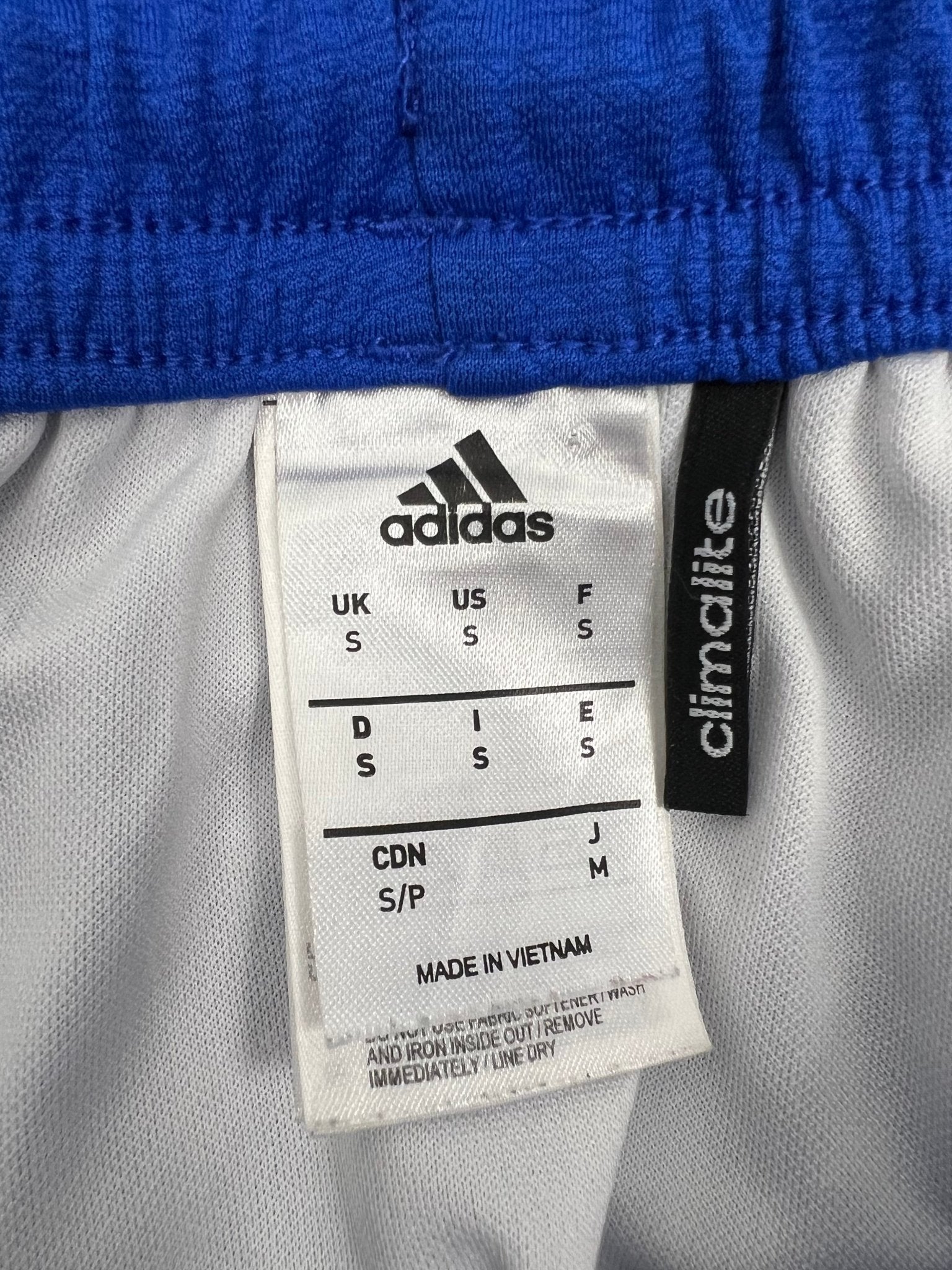 adidas Climalite shorts inner label showing size small
