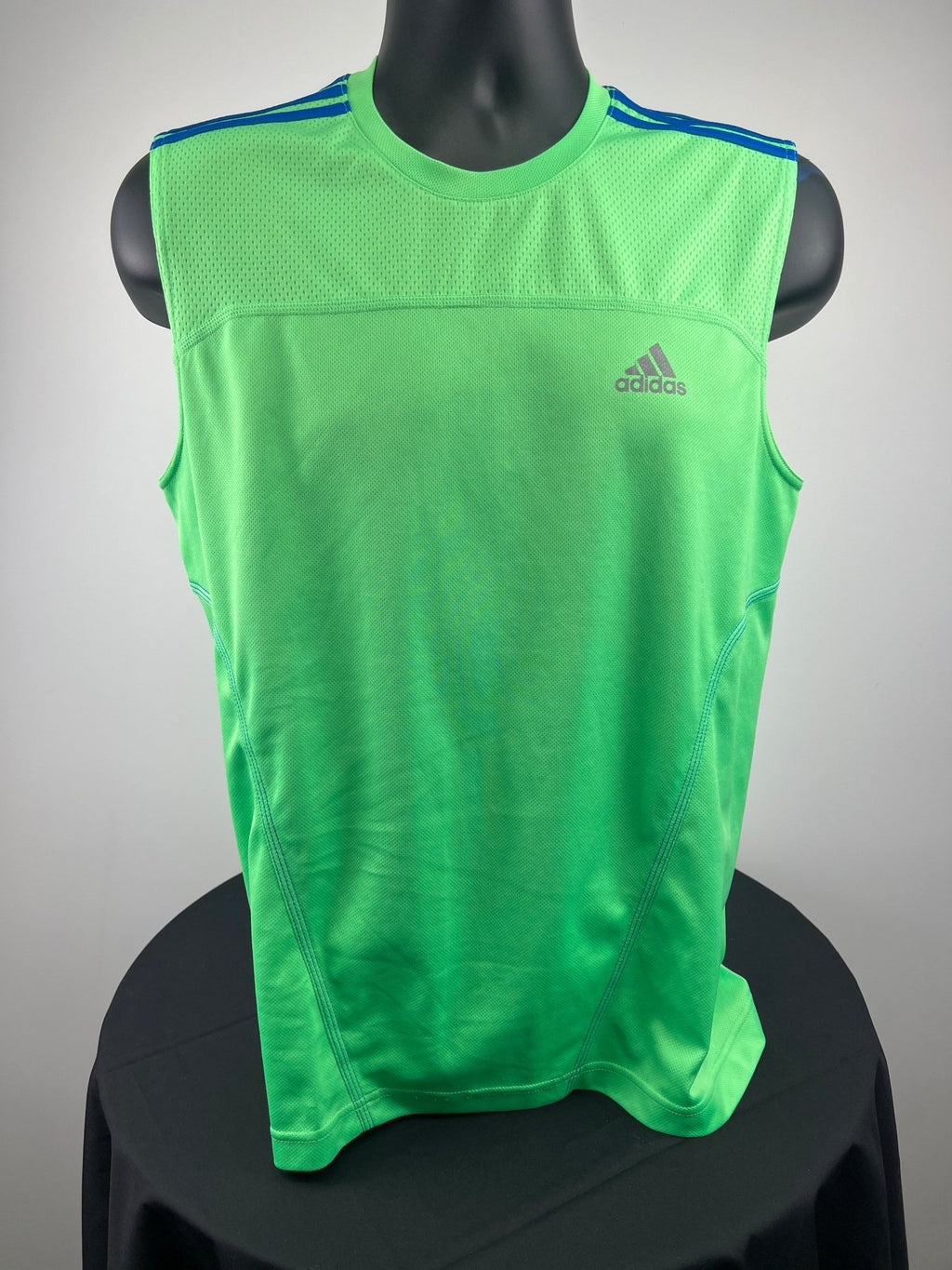 Front view of green adidas Climalite running vest, size medium