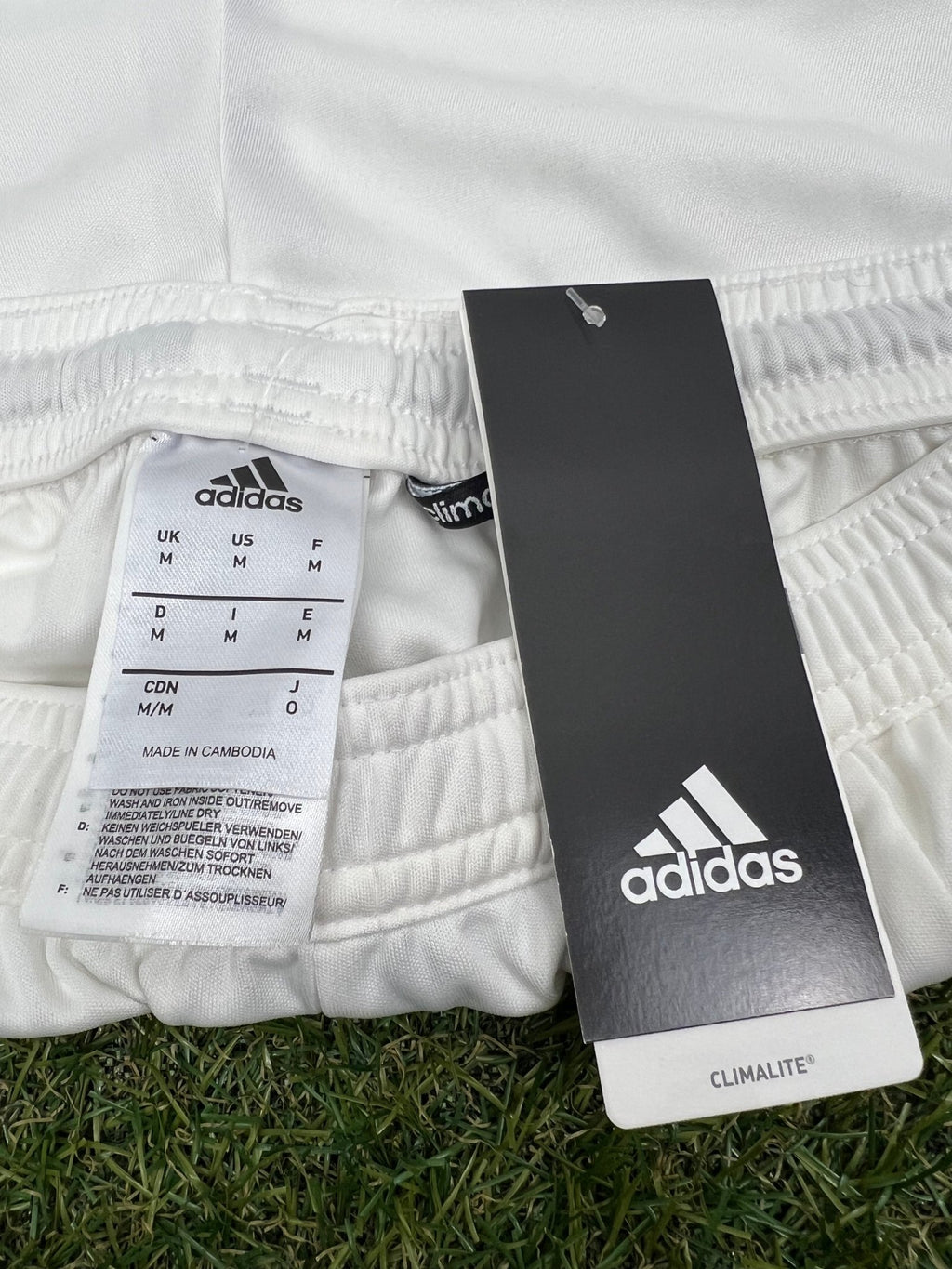 Close-up of adidas Climalite label and size tag on waistband