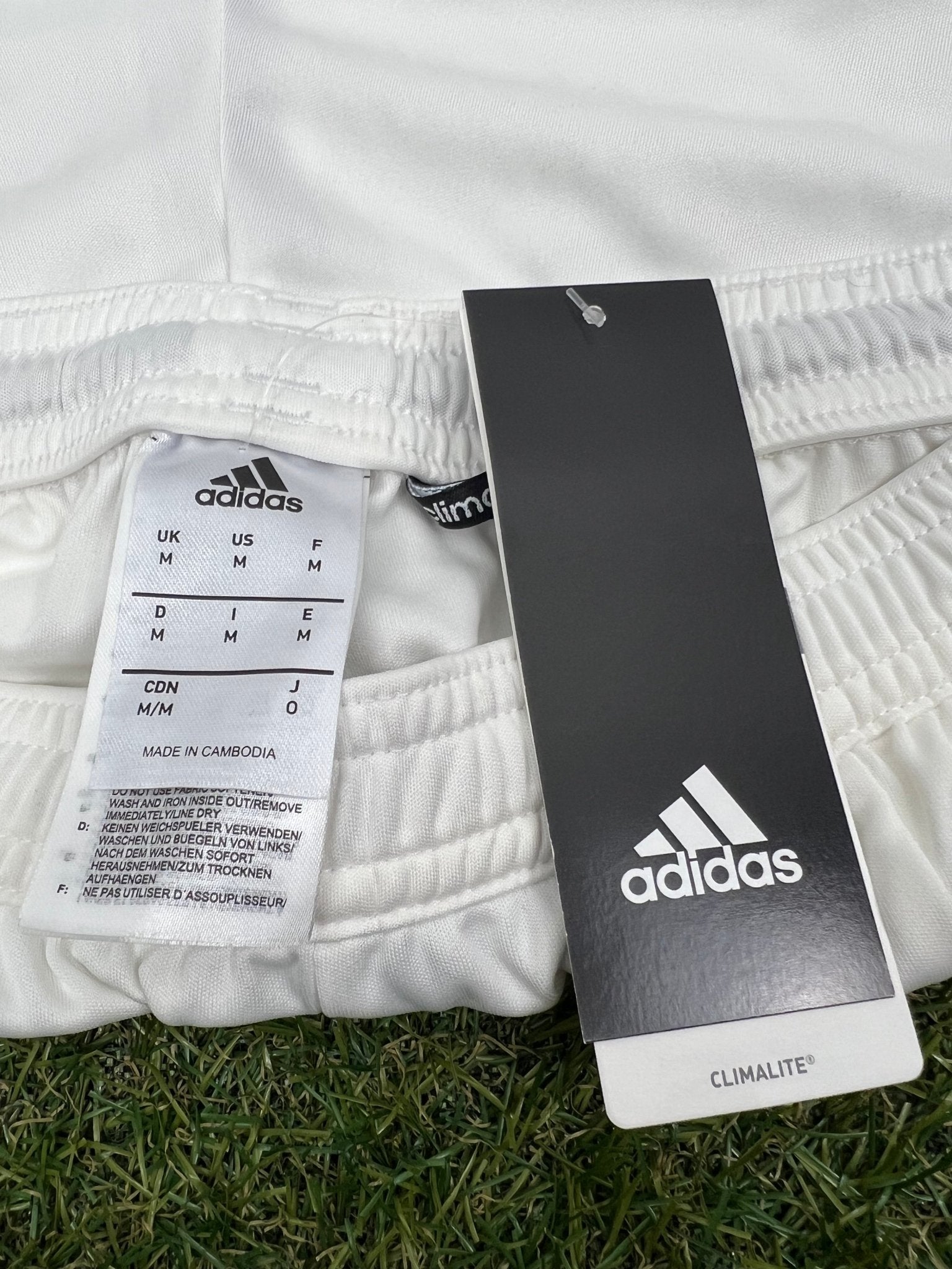 Close-up of adidas Climalite label and size tag on waistband