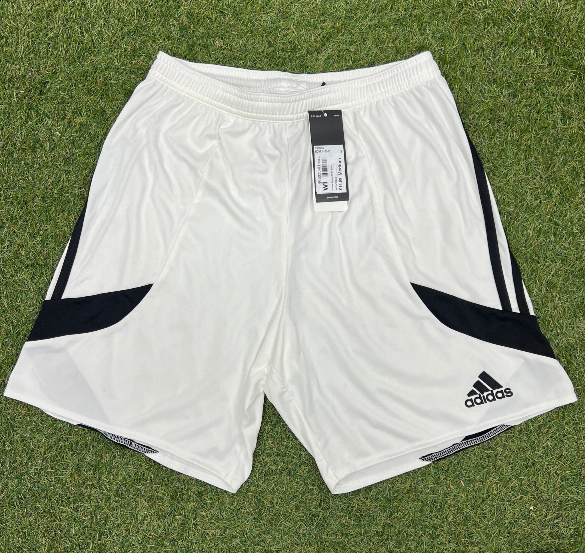 Front view of adidas white Climalite sports shorts with black accents