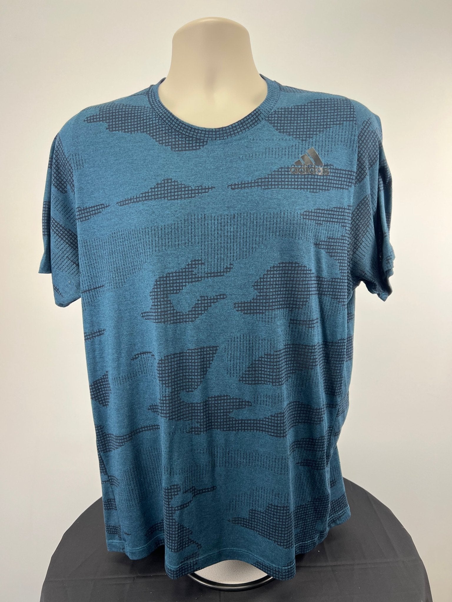 Front view of blue adidas FreeLift Climalite t-shirt in large size with graphic pattern