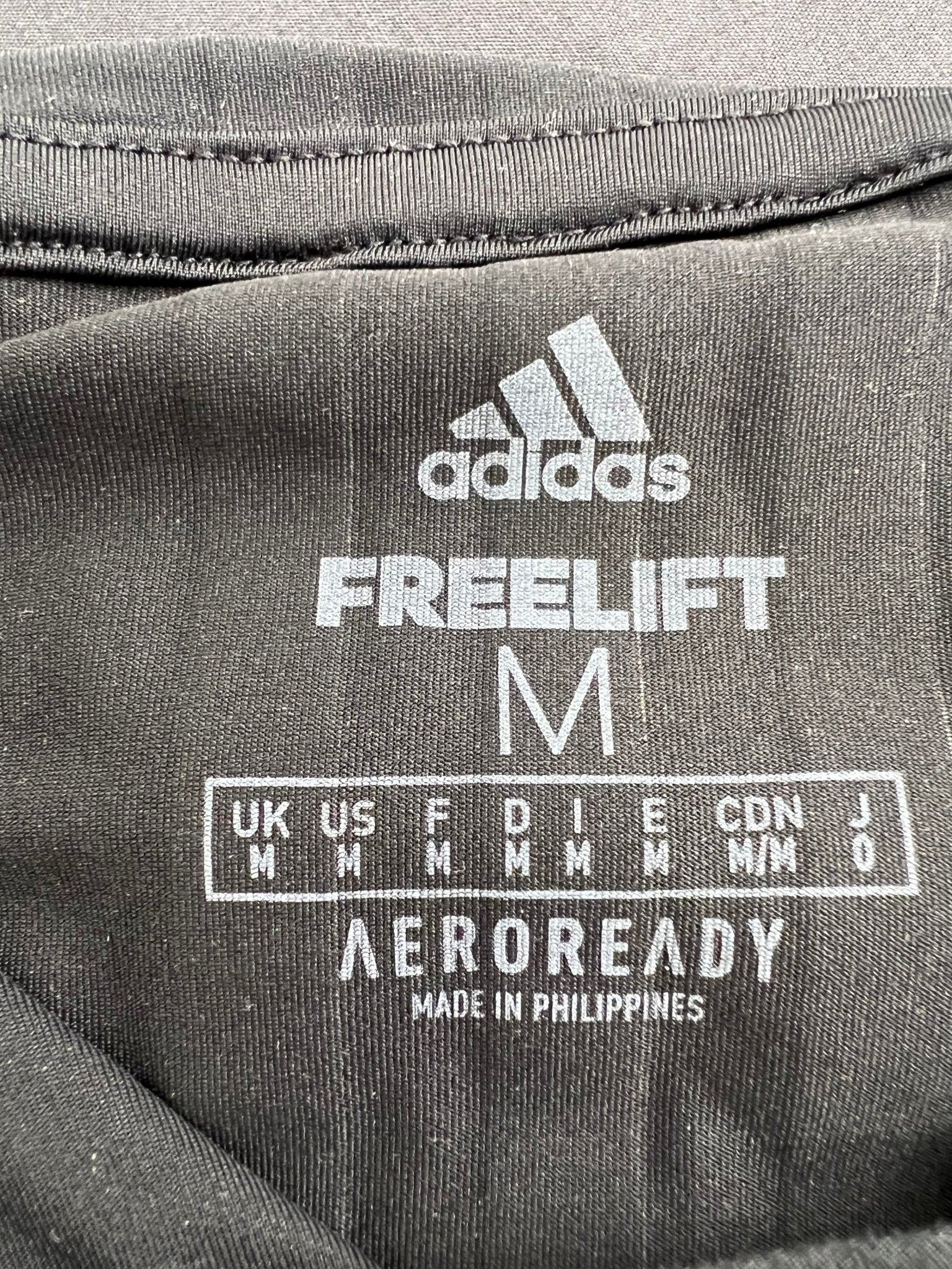 Inner label showing adidas Freelift AEROREADY medium size details