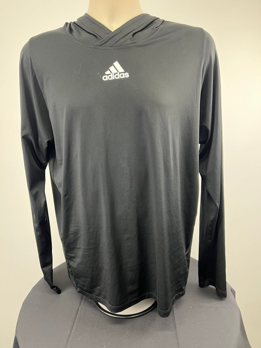 Front view of black adidas Freelift hooded top in medium size