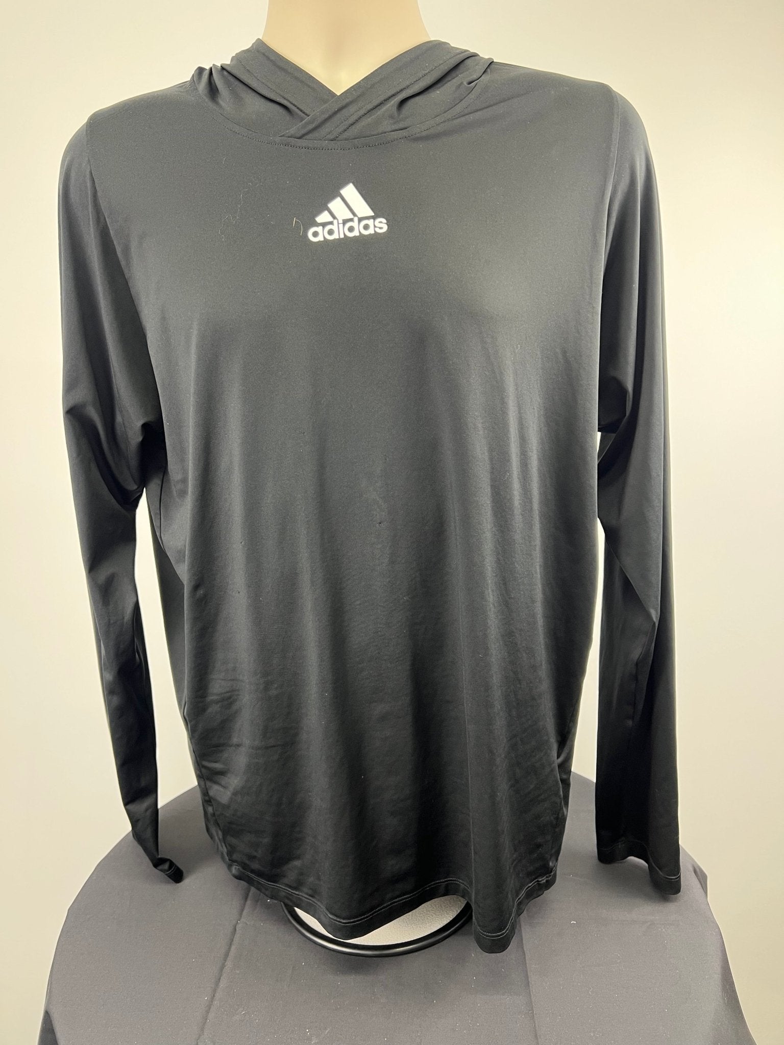 Front view of black adidas Freelift hooded top in medium size