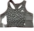 Front view of grey adidas sports bra with leopard print design