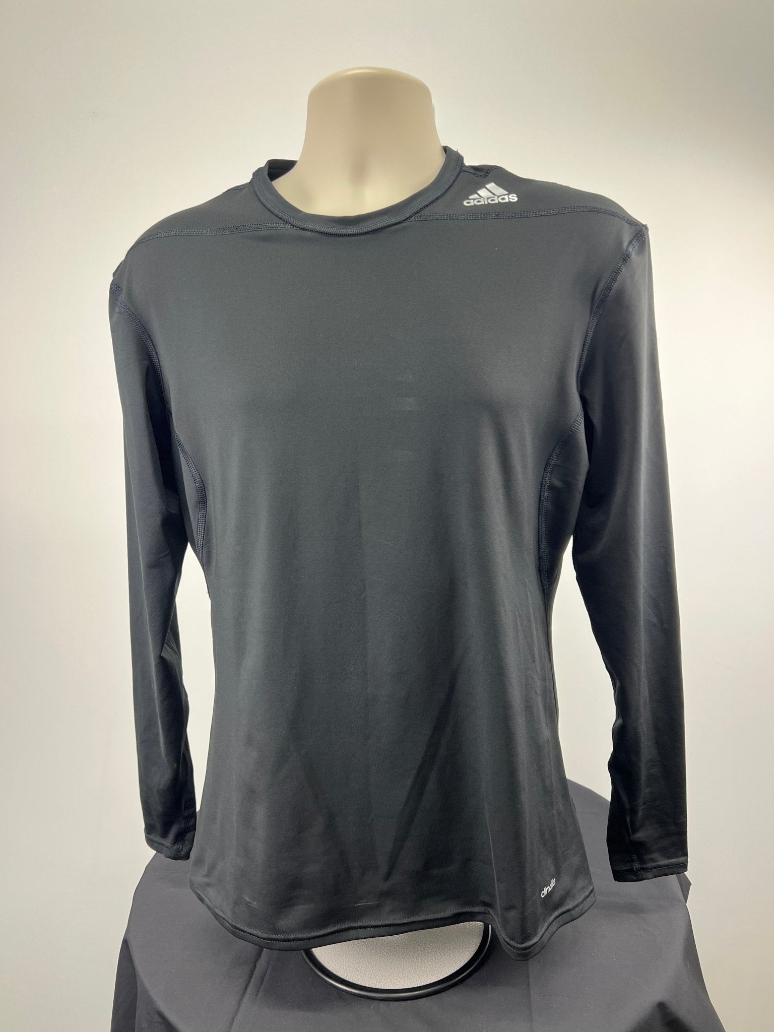 Front view of black Adidas Techfit compression long sleeve top in size XL