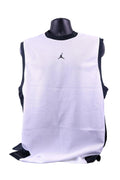 Front view of Air Jordan white mesh basketball training top with black trim and Jumpman logo