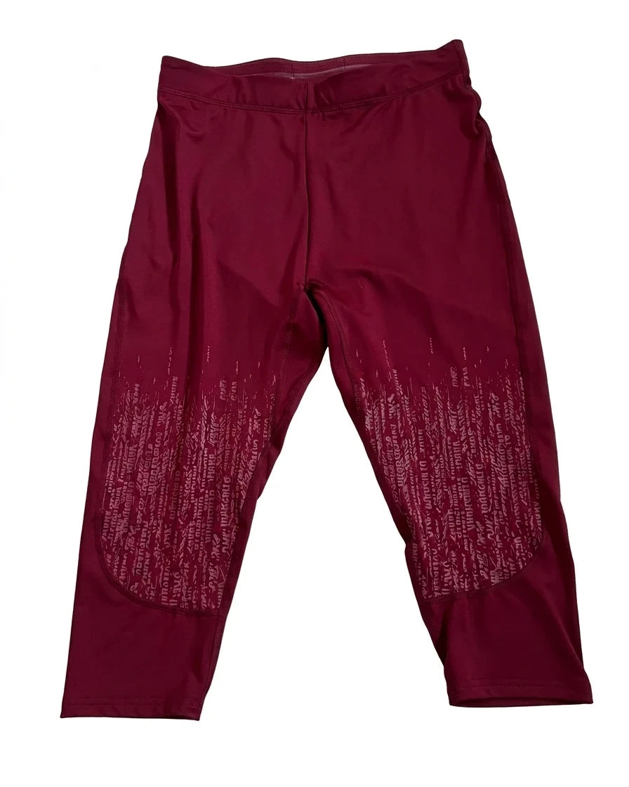 Enhanced Front view of burgundy Gymshark cropped leggings with patterned detailing on lower legs