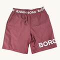 Björn Borg maroon poly-blend training shorts with elastic waistband and 'BORG' logo print on leg. Size L.