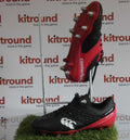 Pair of Canterbury rugby boots in black and red with metal studs on display