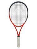 A photorealistic product shot of the Head Radical Junior You Trek tennis racket, with its orange and black frame and white grip, isolated on a clean white background.