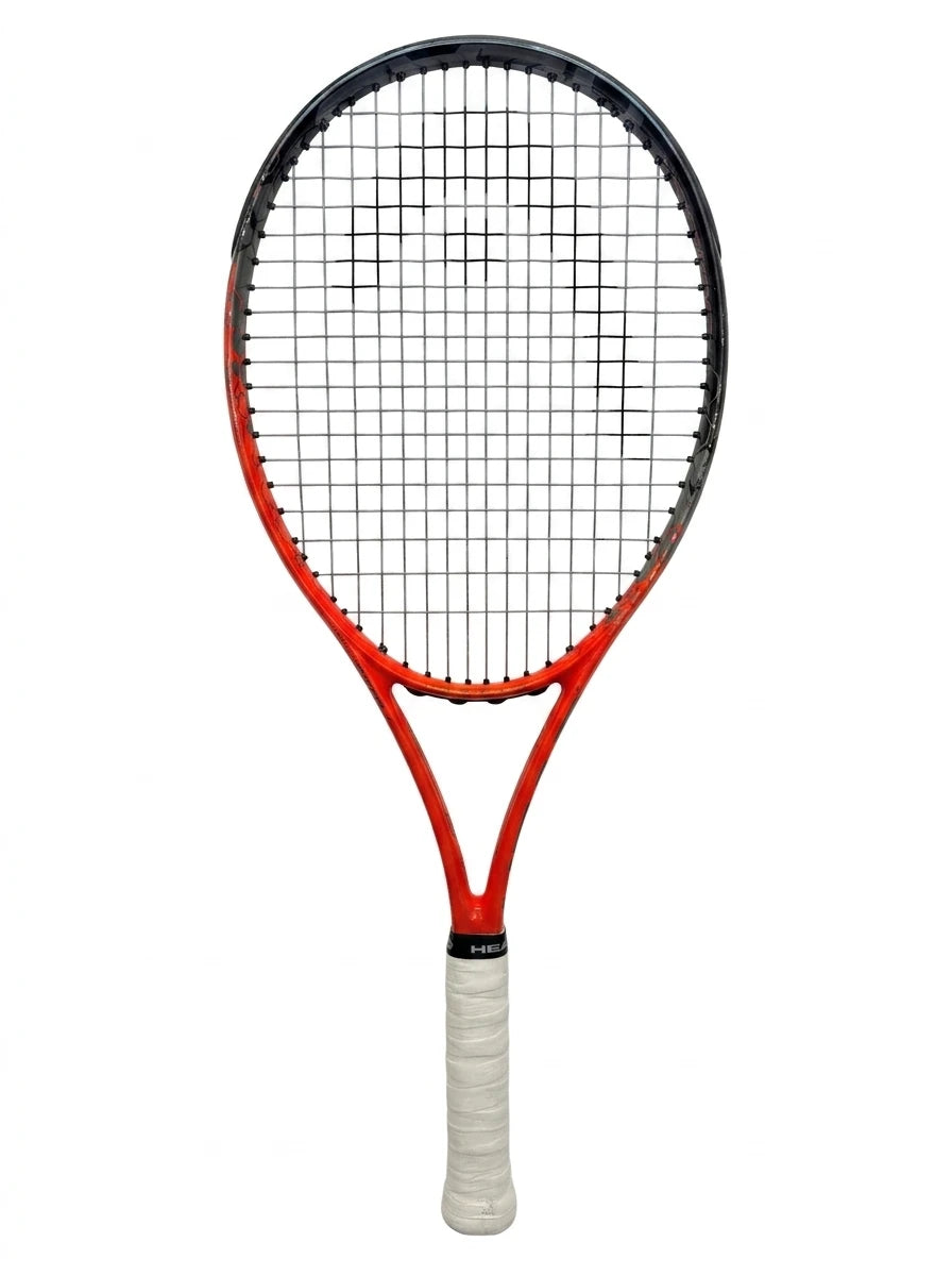 A photorealistic product shot of the Head Radical Junior You Trek tennis racket, with its orange and black frame and white grip, isolated on a clean white background.