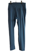 Rear view of CRZ Yoga petrol blue sports leggings on hanger