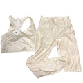 Fabletics cream activewear set with sports bra and leggings, size medium