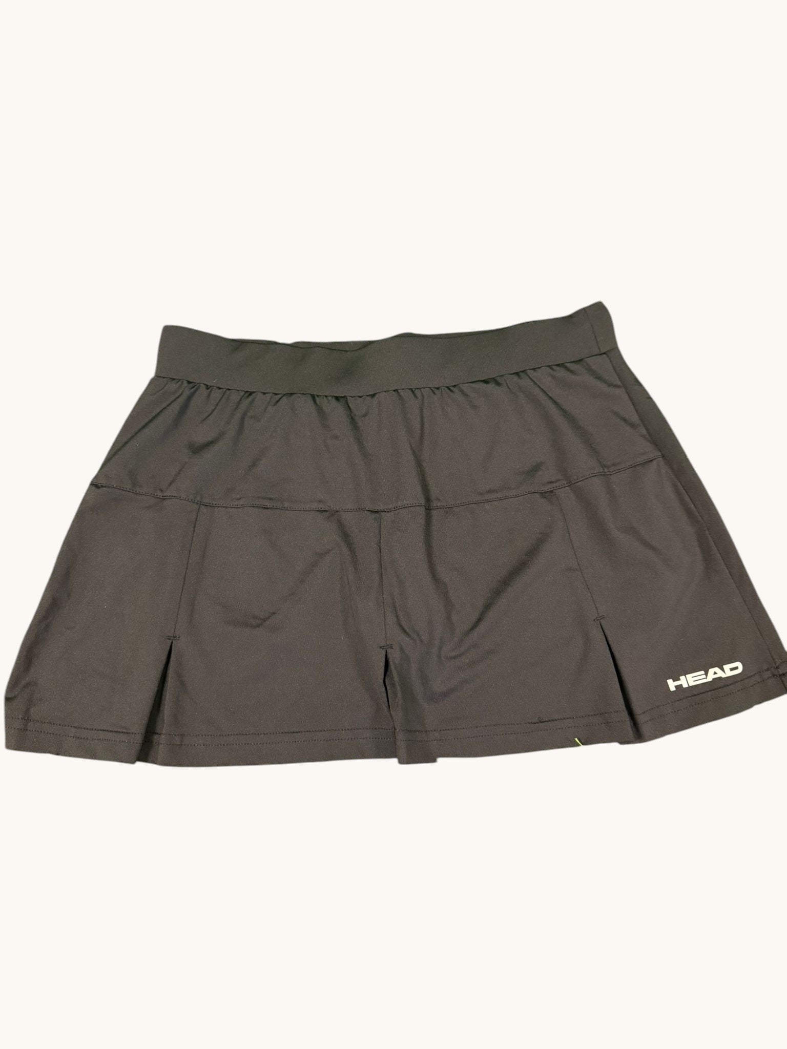 Black HEAD tennis skirt with wide waistband and subtle pleats, lightweight and stretchy fabric.