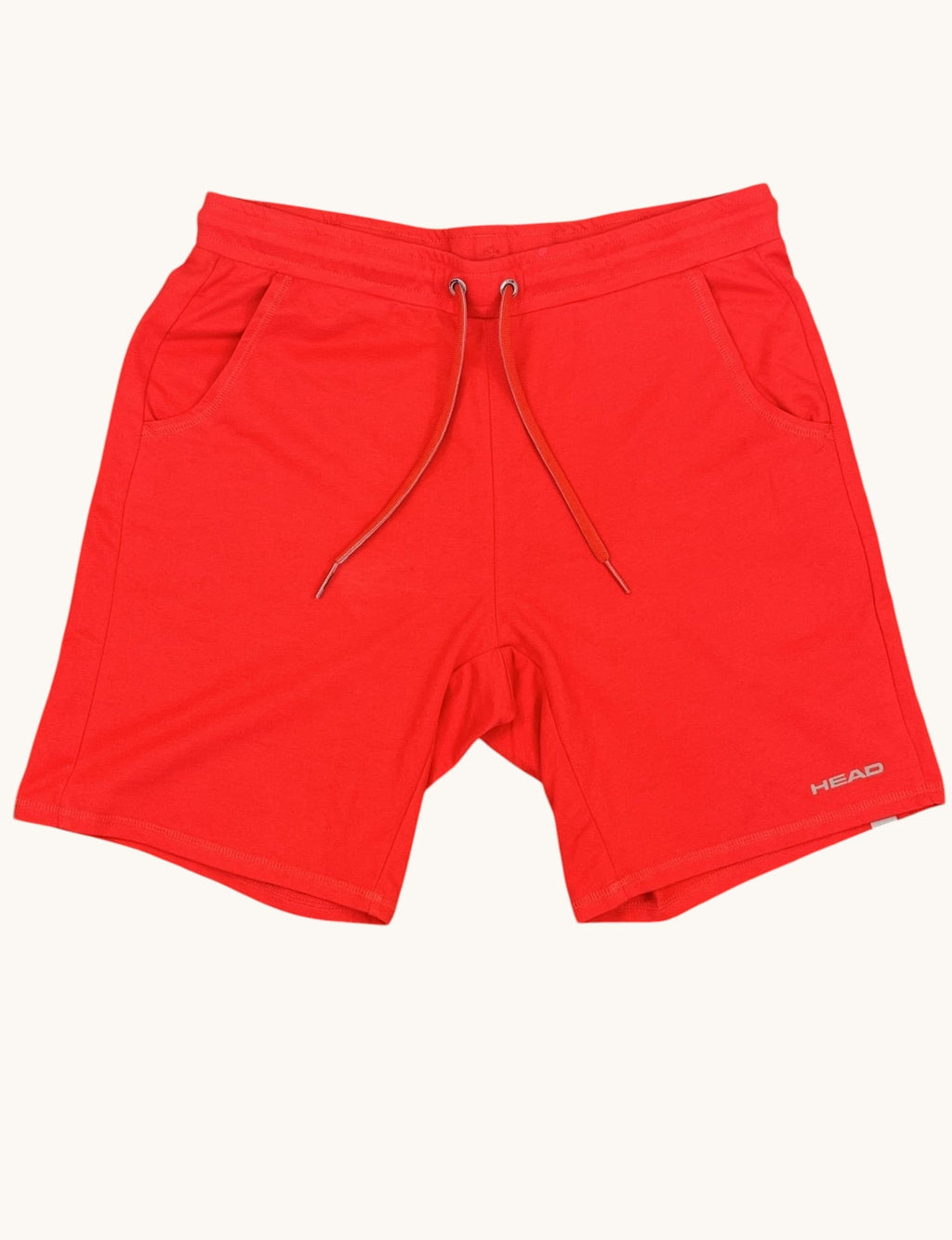 Head red sports shorts with drawstring waist and two side pockets, made from breathable fabric.